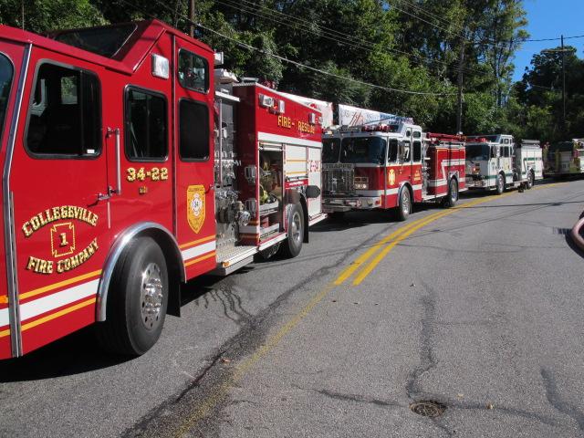 Fire apparatus lined up from fire scene to Sowers Avenue