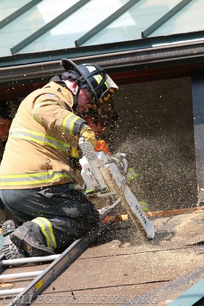 Alex Wiltz working the saw, opening up the roof. 
Photo courtesy or Dan Miller.