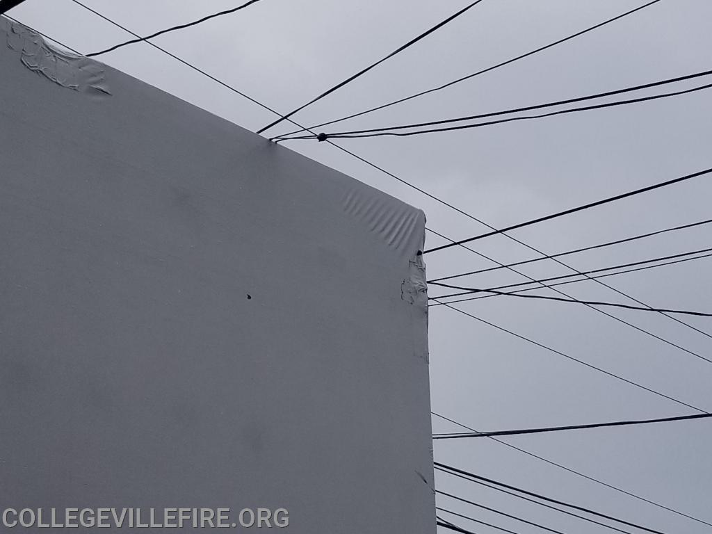 Over size load, pulls down wires and damages building in the 300 block of E. Main Street, Collegeville Borough.